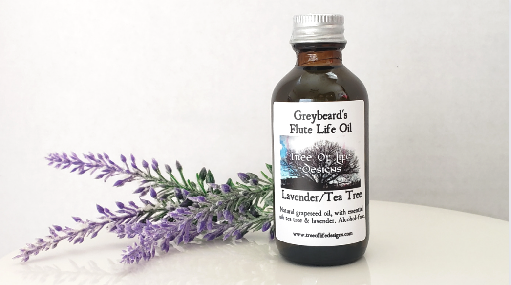 Bottle of Antiseptic Oil for Native Flutes shown beside lavender sprigs